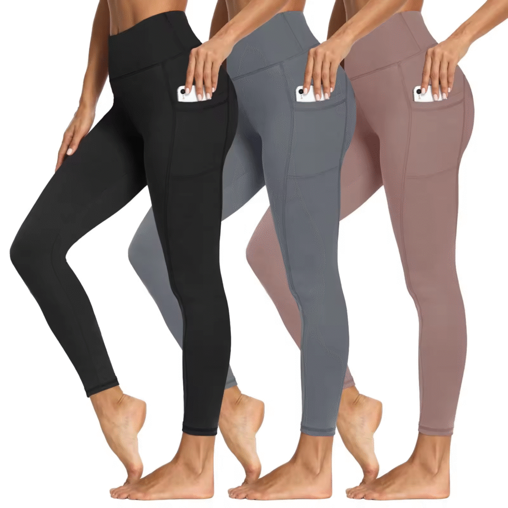Three women wearing high-waisted leggings in black, gray, and mauve, each with side pockets holding a smartphone.