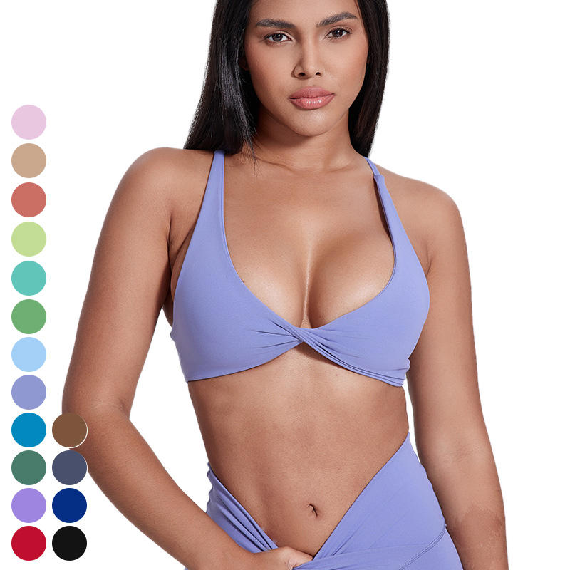 Woman wearing a lavender purple halter sports bra, with various color options shown on the side.