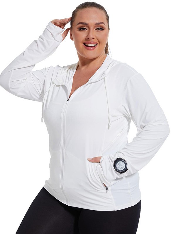 A plus-size woman wearing a white zip-up hoodie with a hood, paired with black leggings, accessorized with a watch, showcasing a comfortable and active athleisure style.