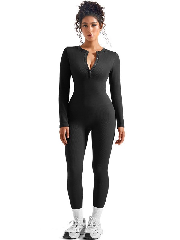 Black zip-up one-piece bodysuit with ribbed fabric, long sleeves, and a stylish V-neck design, paired with sneakers.