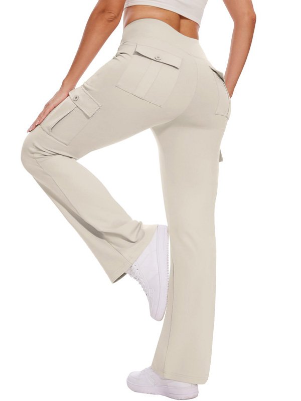 A pair of high-waisted cargo yoga pants in beige, featuring side pockets, worn by a model in white sneakers, showcasing both style and functionality
